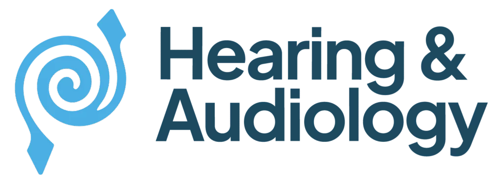 Logo with a blue spiral ear graphic on the left and the words Hearing & Audiology in bold dark blue letters on the right.